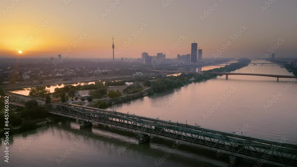 Vienna skyline aerial view at sunrise, vienna austria city view of river and skyscrapers drone fly over brdige. Vienna skyline aerial view at sunrise, vienna austria city view of river and skyscrapers drone fly over brdige.
