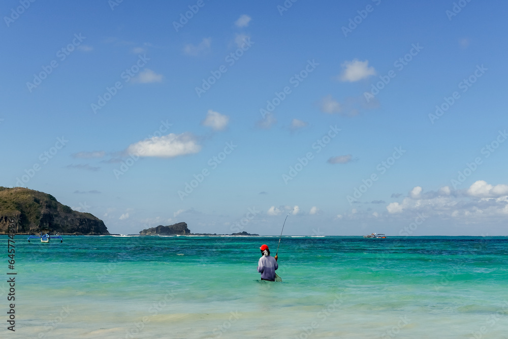 fishing on the beach, fisherman on the beach, traditional angler, local residents fishing on Lombok beach, tanjung aan beach lombok, fishing on the beach on a sunny day fishing on the beach, fisherman on the beach, traditional angler, local residents fishing on Lombok beach, tanjung aan beach lombok, fishing on the beach on a sunny day