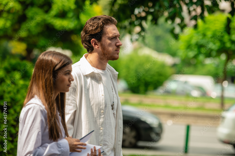 Two college students walking outside