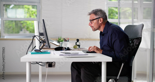 Bad Posture Sitting In Office Chair photo