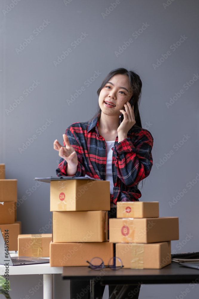 Startup happy Asian woman sme business owner work with prepare parcel delivery boxs at home, SME supply chain, procurement, package box to deliver to customers, Online SME business entrepreneurs ideas Startup happy Asian woman sme business owner work with prepare parcel delivery boxs at home, SME supply chain, procurement, package box to deliver to customers, Online SME business entrepreneurs ideas