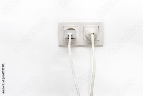White double outlet on white wall