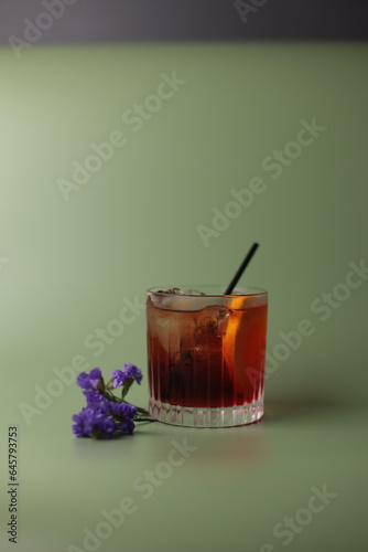 Whiskey in glass with flowers