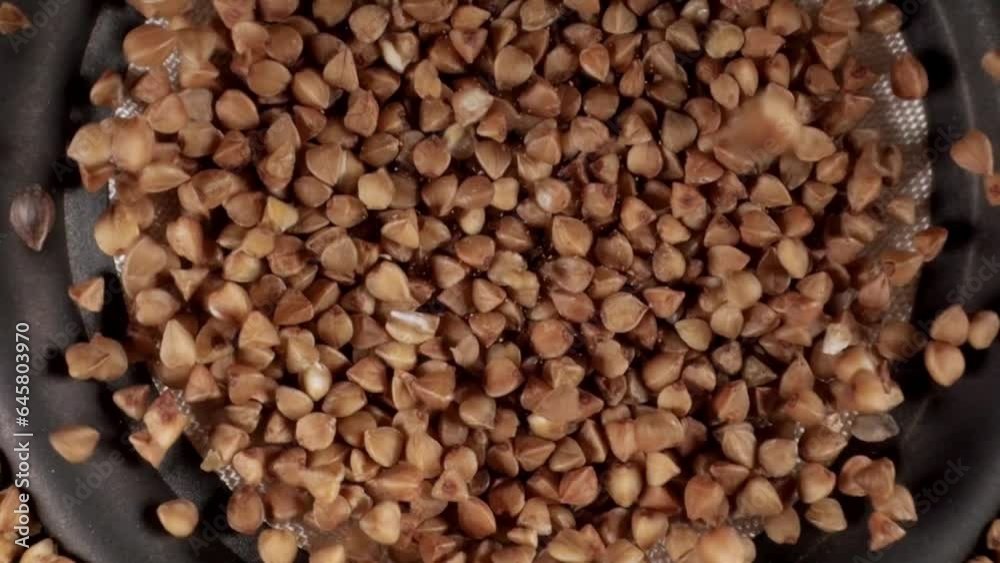 Buckwheat groats. Dry raw brown buckwheat. Grains of buckwheat. Healthy organic food diet concept. Close-Up. Porridge Macro. Buckwheat groats. Dry raw brown buckwheat. Grains of buckwheat. Healthy organic food diet concept. Close-Up. Porridge Macro.