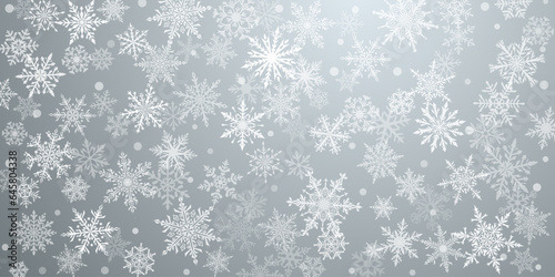 Christmas background of beautiful complex snowflakes in gray colors. Winter illustration with falling snow