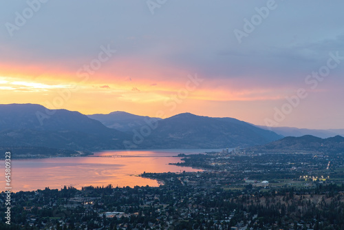 Kelowna at sunset. View of Kelowna from Kuiper's Peak Mountain Park.