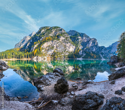 Autumn peaceful alpine lake Braies or Pragser Wildsee. Fanes-Sennes-Prags national park, South Tyrol, Dolomites Alps, Italy, Europe. Picturesque traveling, seasonal and nature beauty concept scene. photo