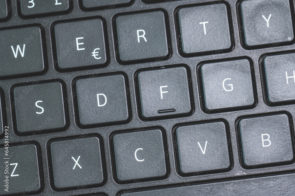 D F G keys on a black laptop keyboard.