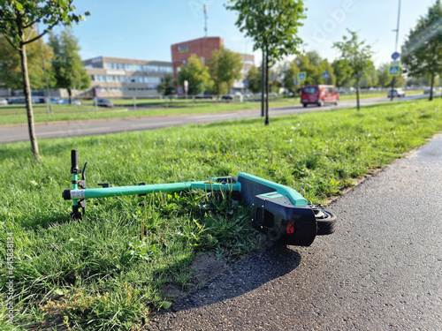 Green electric scooter broken down