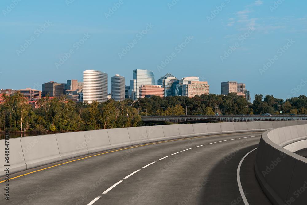 Obraz premium Empty urban asphalt road exterior with city buildings background. New modern highway concrete construction. Concept way to success. Transportation logistic industry fast delivery. Arlington. USA.