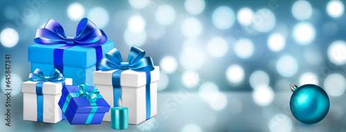 Holiday illustration with several colored gift boxes with ribbons and bows, burning candles and Christmas balls on a blurred background with bokeh effect in light blue colors