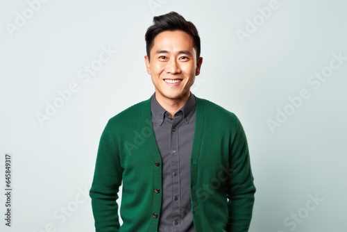 Portrait photography of a Vietnamese man in his 30s against a white background