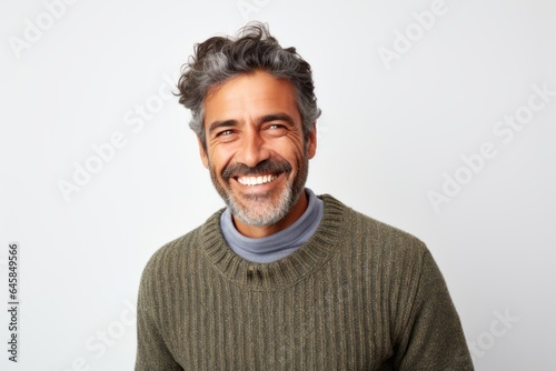 Medium shot portrait photography of a Peruvian man in his 40s against a white background