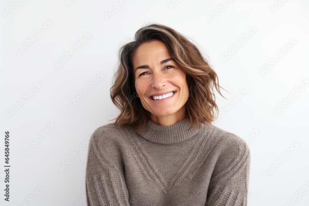 Medium shot portrait photography of a French woman in her 40s wearing a cozy sweater against a white background Medium shot portrait photography of a French woman in her 40s wearing a cozy sweater against a white background
