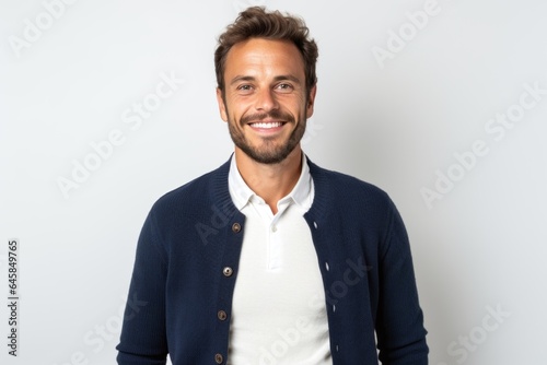 Lifestyle portrait photography of a French man in his 30s against a white background