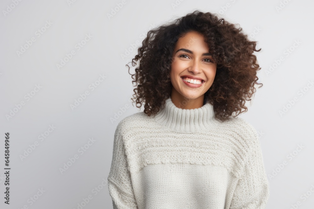 Portrait photography of a cheerful Colombian woman in her 30s wearing a cozy sweater against a white background Portrait photography of a cheerful Colombian woman in her 30s wearing a cozy sweater against a white background