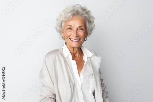 Medium shot portrait photography of a French woman in her 90s against a white background