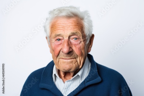 Portrait photography of a French man in his 90s against a white background © Anne Schaum