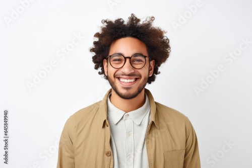 Medium shot portrait photography of a Colombian man in his 20s against a white background