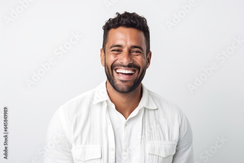 Medium shot portrait photography of a Colombian man in his 30s against a white background