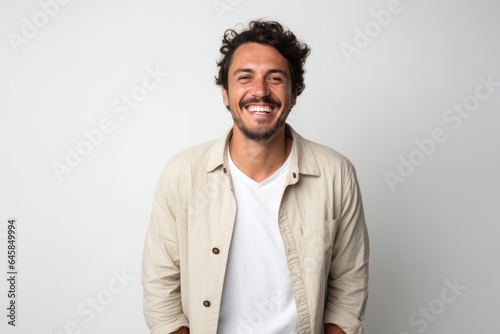 Lifestyle portrait photography of a Colombian man in his 30s against a white background