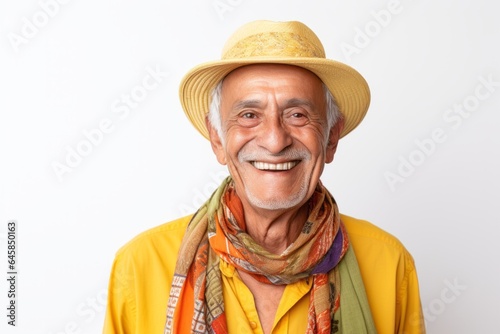 Medium shot portrait photography of a Colombian man in his 70s wearing a foulard against a white background