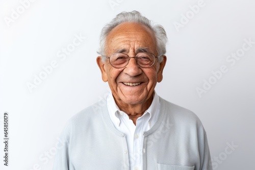 Medium shot portrait photography of a Colombian man in his 90s against a white background