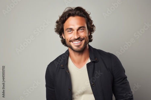 Portrait photography of a French man in his 30s against a minimalist or empty room background