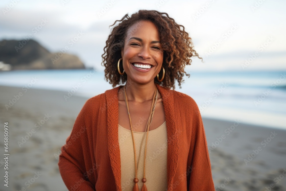 Medium shot portrait photography of a Peruvian woman in her 40s against a beach background