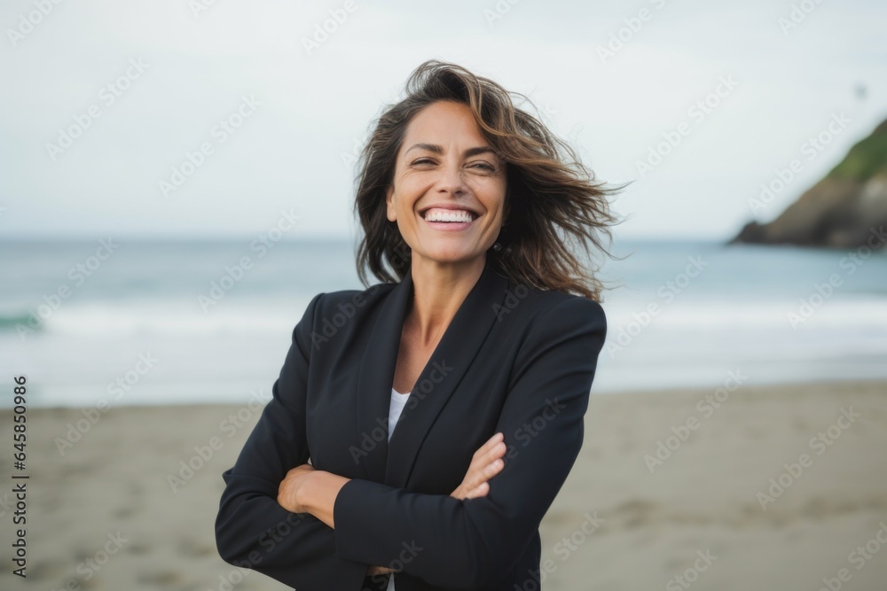 Medium shot portrait photography of a Peruvian woman in her 40s wearing a sleek suit against a beach background Medium shot portrait photography of a Peruvian woman in her 40s wearing a sleek suit against a beach background