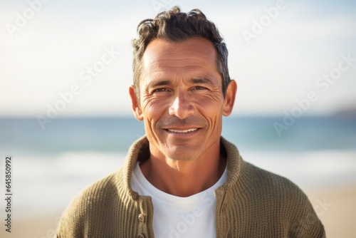 Medium shot portrait photography of a Peruvian man in his 40s against a beach background