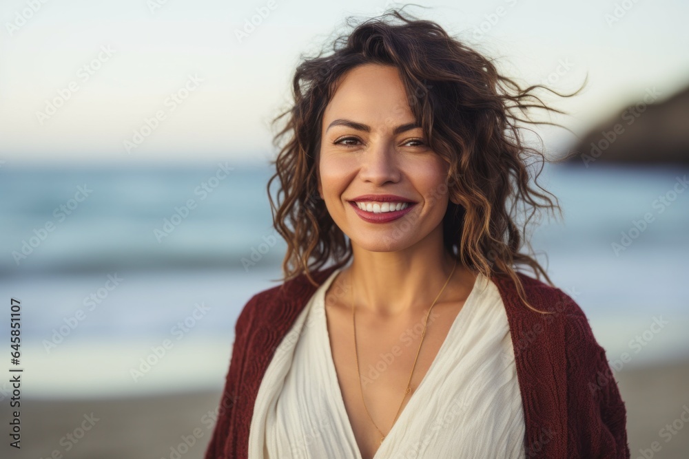 Medium shot portrait photography of a Colombian woman in her 30s against a beach background Medium shot portrait photography of a Colombian woman in her 30s against a beach background