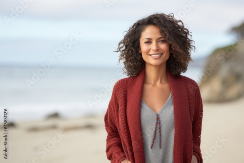 Portrait photography of a Colombian woman in her 40s against a beach background