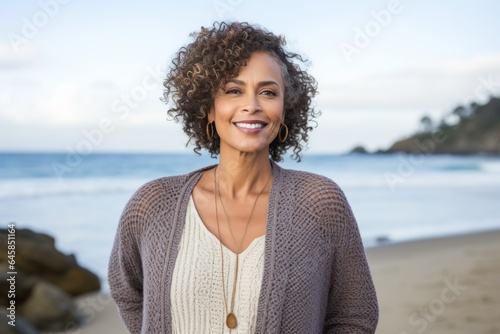 Portrait photography of a Colombian woman in her 50s against a beach background