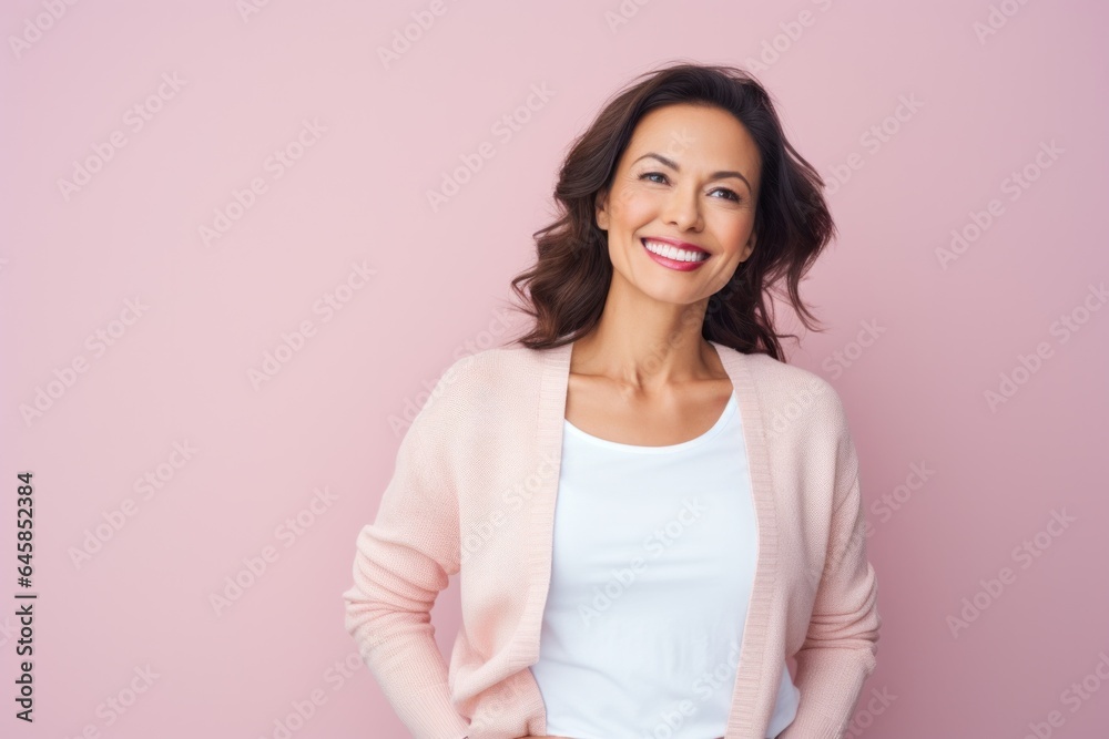 Portrait photography of a cheerful Peruvian woman in her 40s against a pastel or soft colors background Portrait photography of a cheerful Peruvian woman in her 40s against a pastel or soft colors background