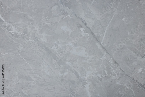 Texture of light grey marble surface as background  closeup