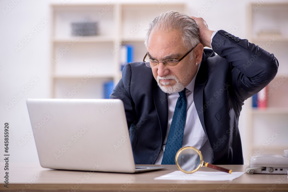 Old male employee and too much work in the office Old male employee and too much work in the office