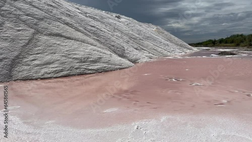 Pink ponds in man-made salt evaporation pans in Camargue, Salin de Giraud, France. Salt production, pink saline.