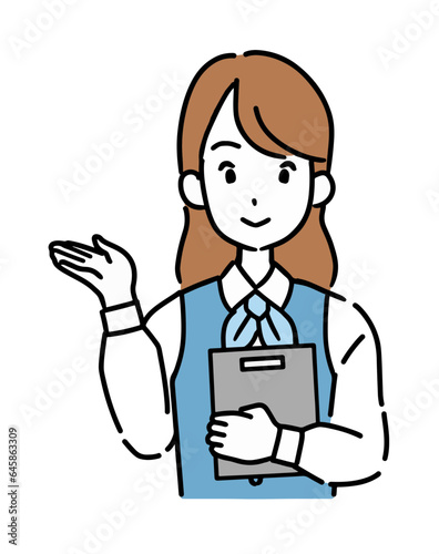 バインダーを持って案内するポーズをとる会社員（女性）