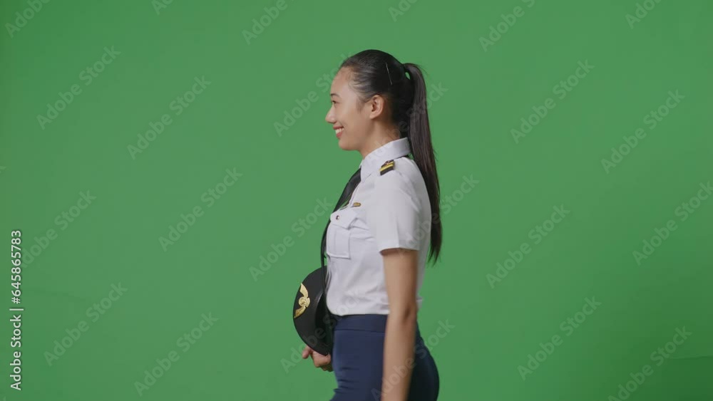 Side View Of Asian Woman Pilot Walking And Smiling In The Green Screen Background Studio
Side View Of Asian Woman Pilot Walking And Smiling In The Green Screen Background Studio