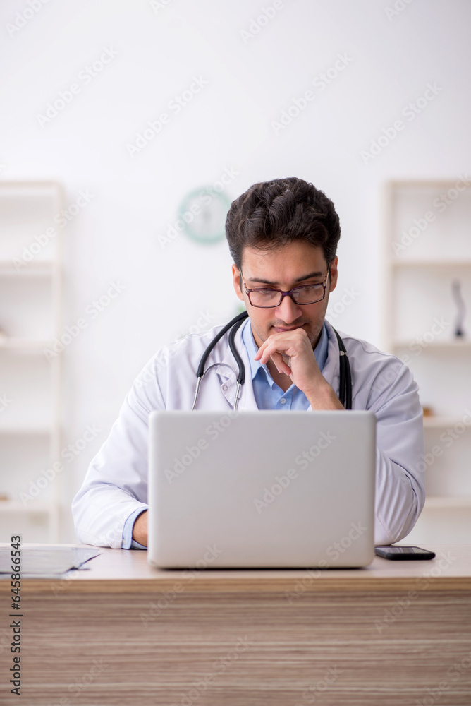 Young male doctor in telemedicine concept Young male doctor in telemedicine concept