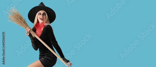 Canvastavla Young witch with broom against light blue background with space for text