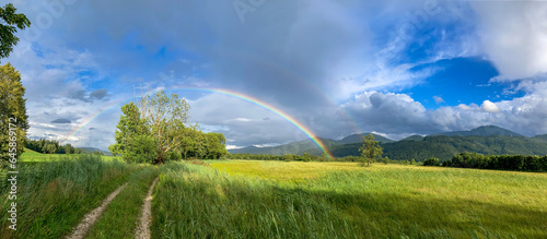 rainbow at the bavarian alpine foothills near Bergen, Chiemgau, Germany
