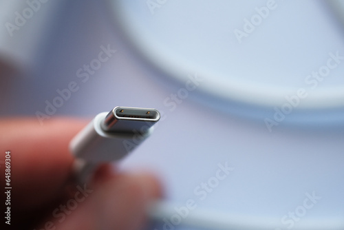 Close up USB Type C and Lightning charge head on a hand selective focus.