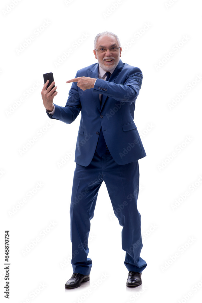 Old businessman talking by phone isolated on white Old businessman talking by phone isolated on white