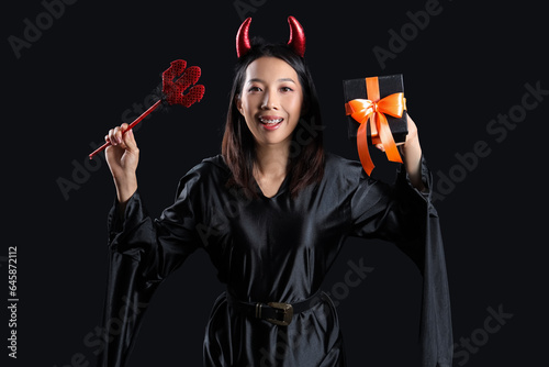 Young Asian woman dressed f...