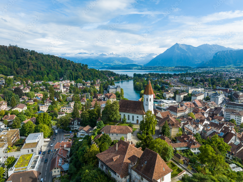 Panoramic view over Thun with its medival church at lake Thun with mount Niesen in the background, Switzerland