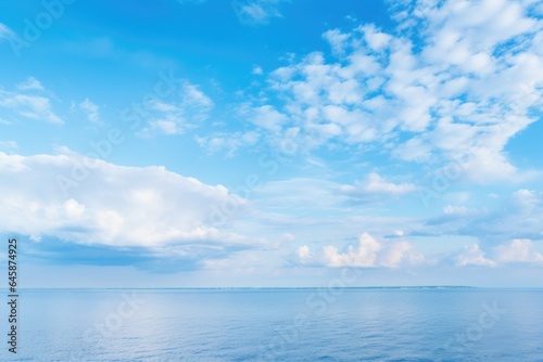 Sea or ocean with a blue sky and white clouds 