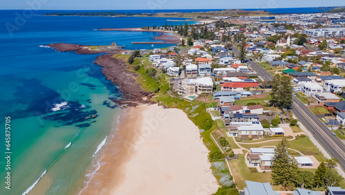 Aerial drone view of Shellharbour above Shellharbour North Beach on the New South Wales South Coast, Australia looking in the south direction toward Shell Cove on a sunny day 