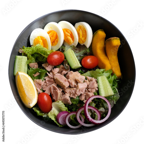 Tuna salad with eggs, tomatoes, pumpkins, lettuce, cucumber and onion isolated on transparent background